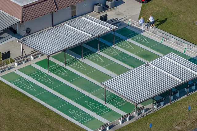 swimming pool view with a seating space