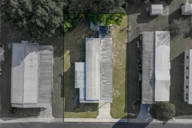 a view of a brick house with a green space