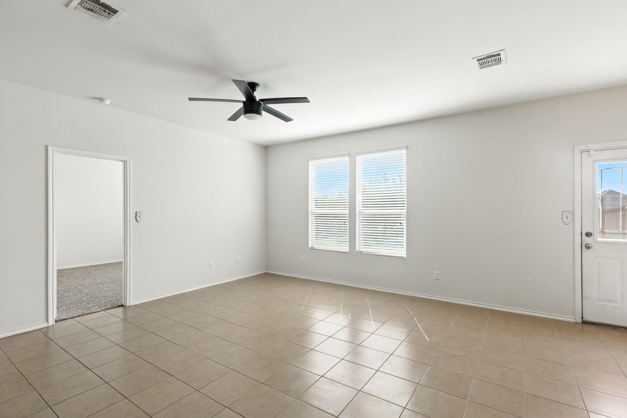 4617 Cleto Street Austin, TX 78725 - Photo 15 of 26 a view of an empty room with a window