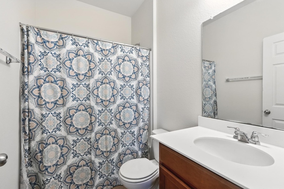 4617 Cleto Street Austin, TX 78725 - Photo 20 of 26 a bathroom with a sink toilet and shower