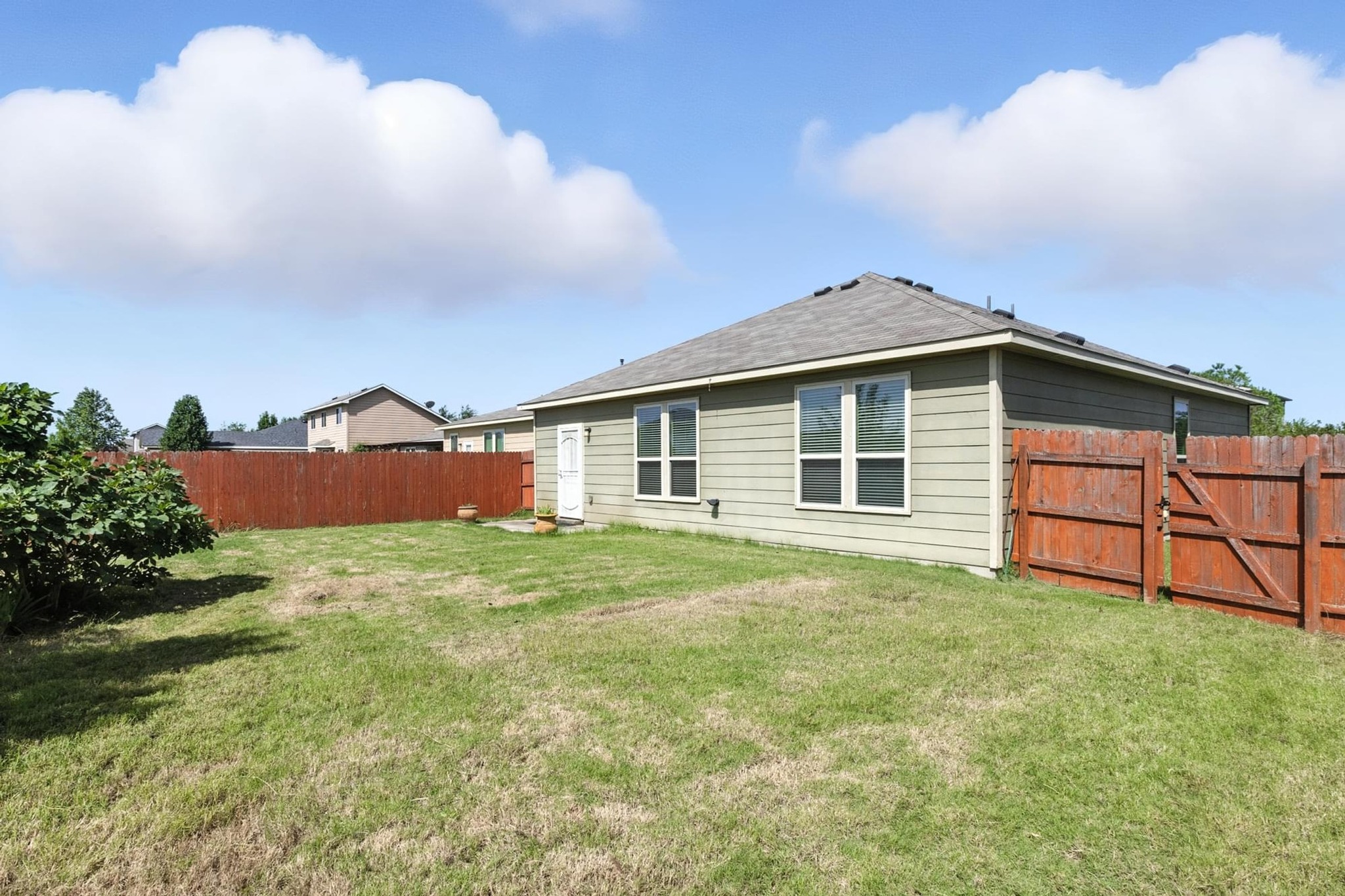 4617 Cleto Street Austin, TX 78725 - Photo 23 of 26 a big house with a big yard and large trees