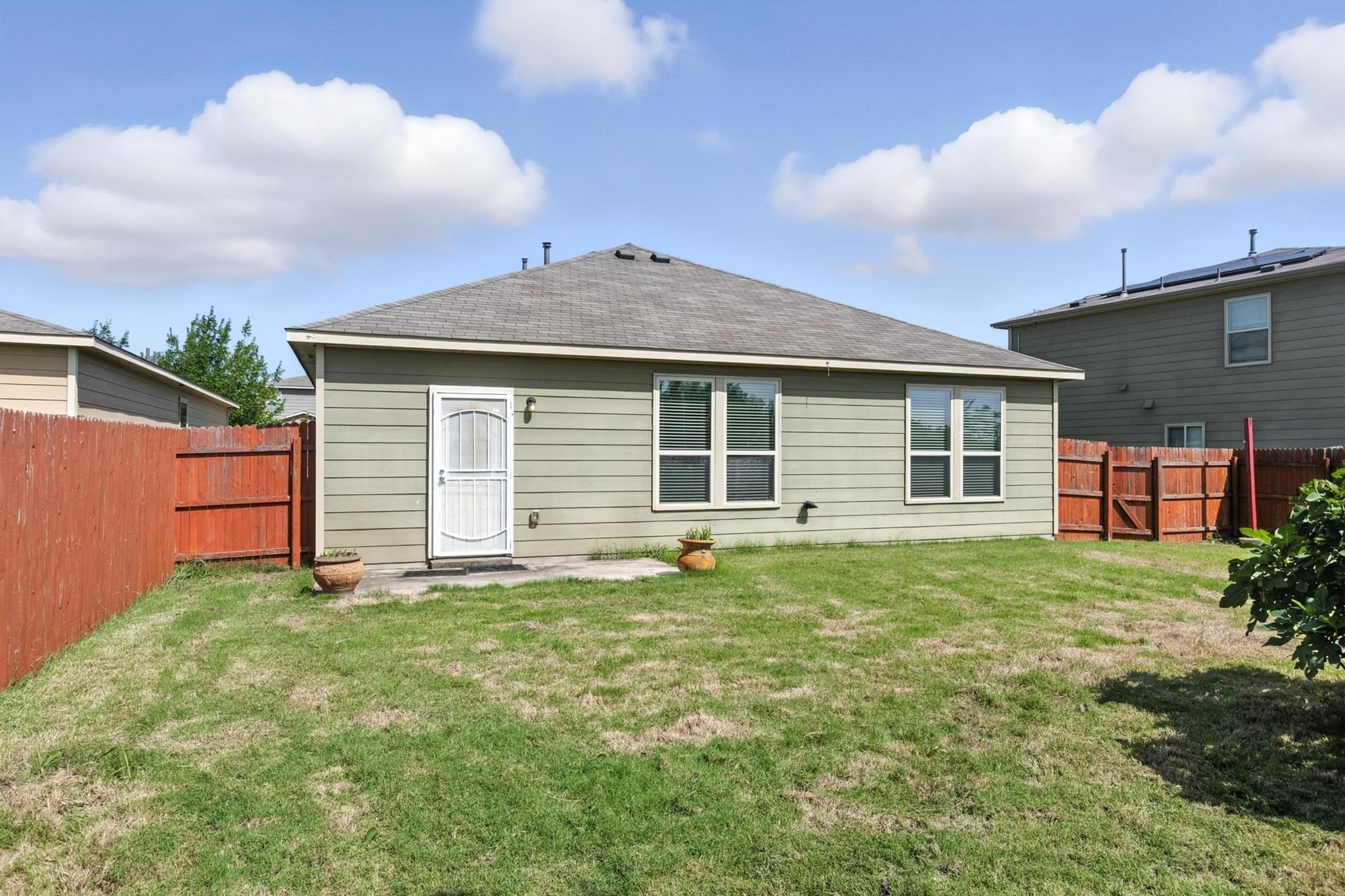 4617 Cleto Street Austin, TX 78725 - Photo 24 of 26 a front view of a house with a garden