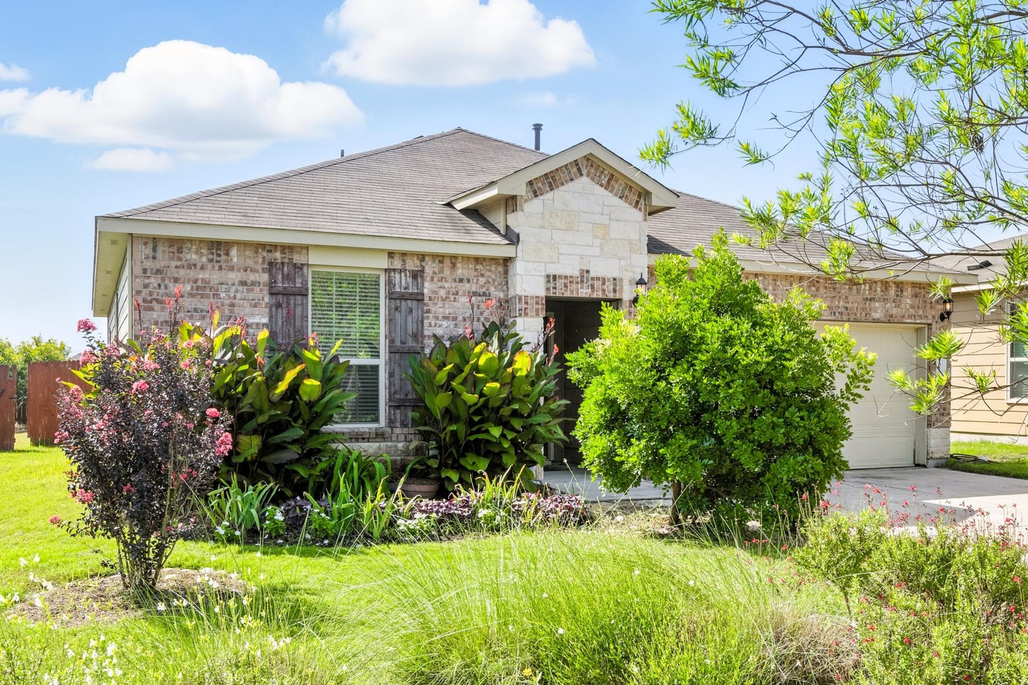 4617 Cleto Street Austin, TX 78725 - Photo 6 of 26 a front view of a house with a yard