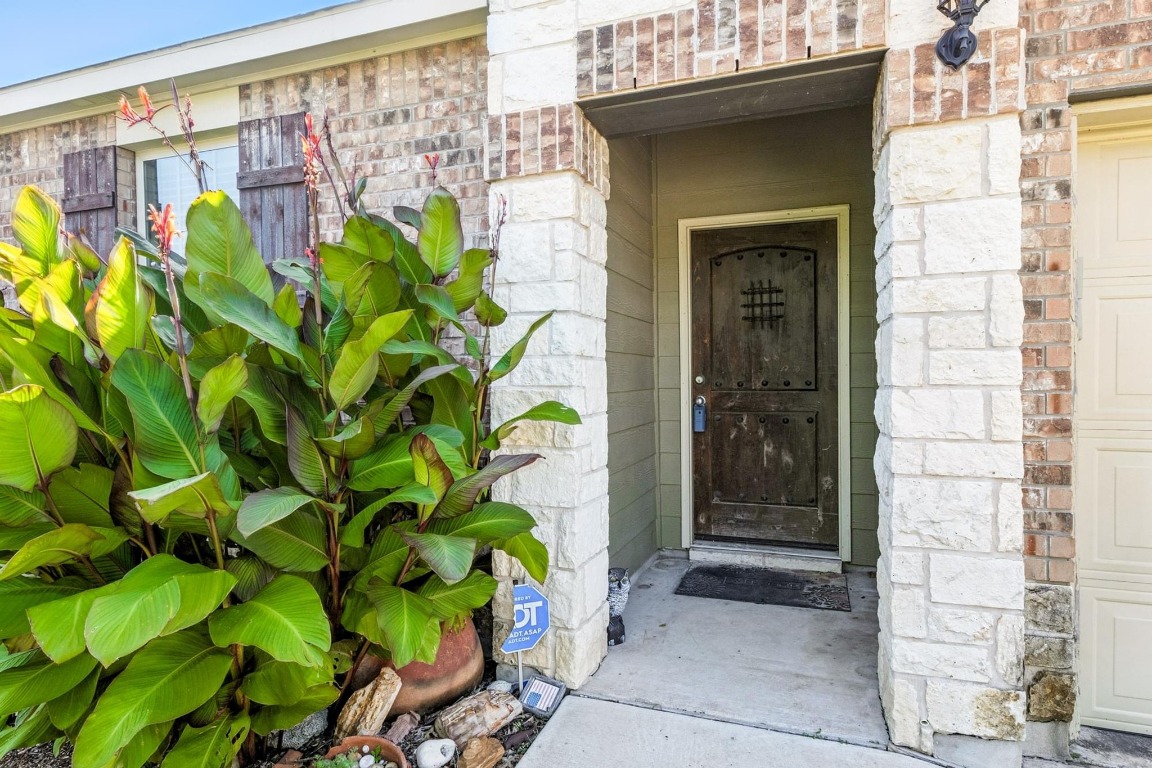4617 Cleto Street Austin, TX 78725 - Photo 7 of 26 a glass door with glass door