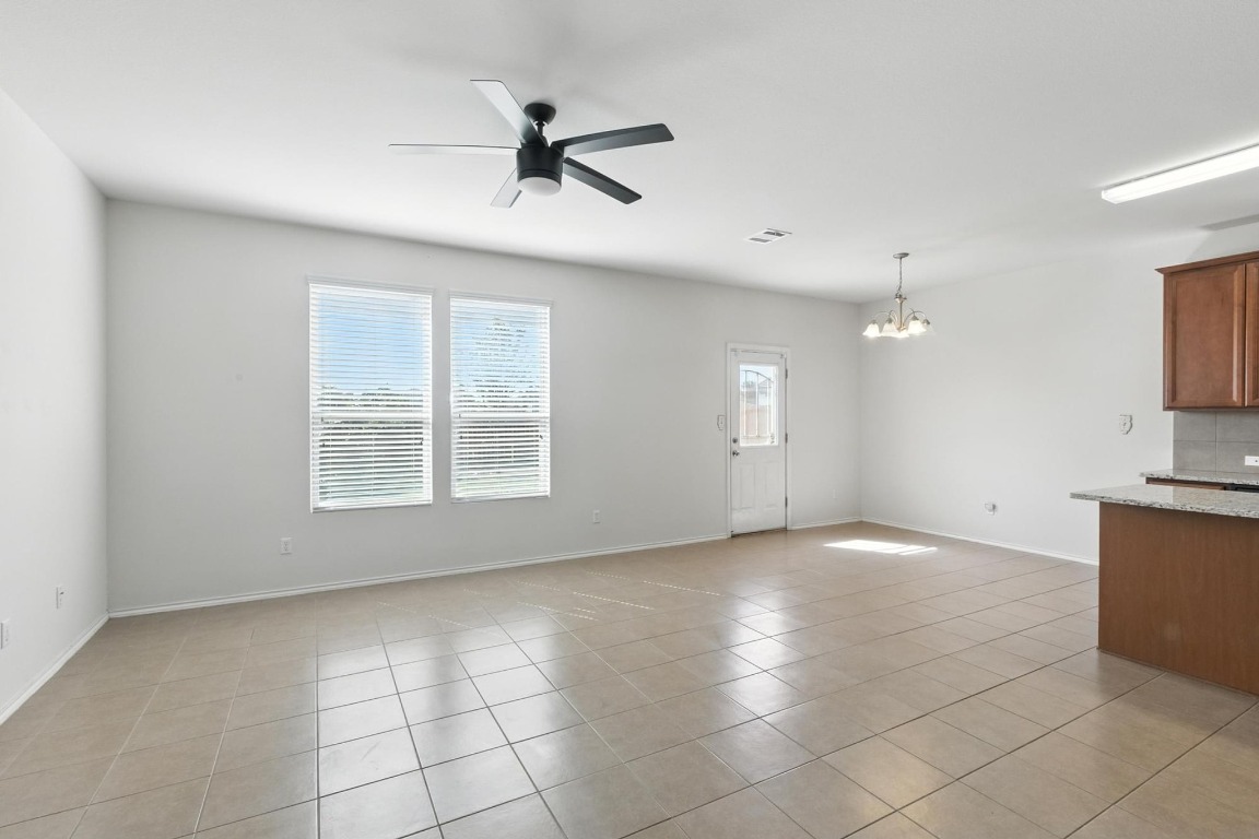 4617 Cleto Street Austin, TX 78725 - Photo 10 of 26 a view of an empty room with a window