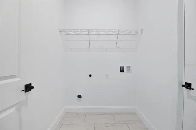 a view of kitchen with stainless steel appliances a refrigerator sink and cabinets