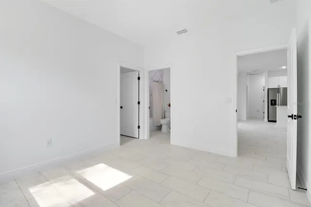 a view of a room with white walls