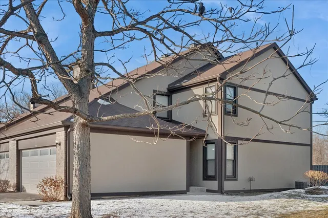 a view of a house with a street