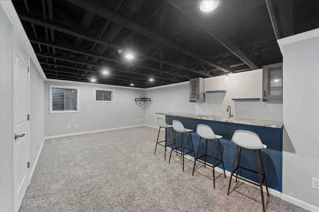 a view of a chairs and table in a room