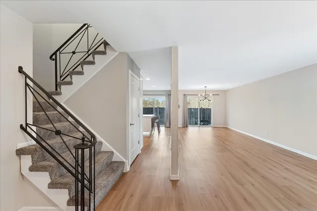 a view of an entryway with wooden floor