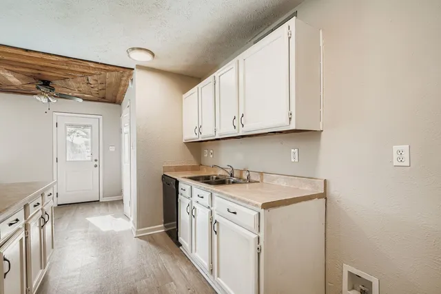 a view of a kitchen with electric appliances