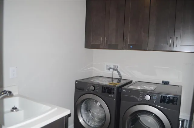 a view of an empty room with closet and wooden floor