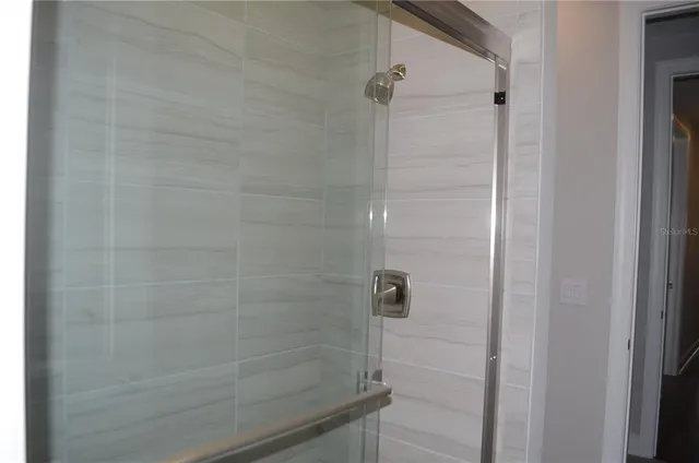 a bathroom with a bathtub and shower