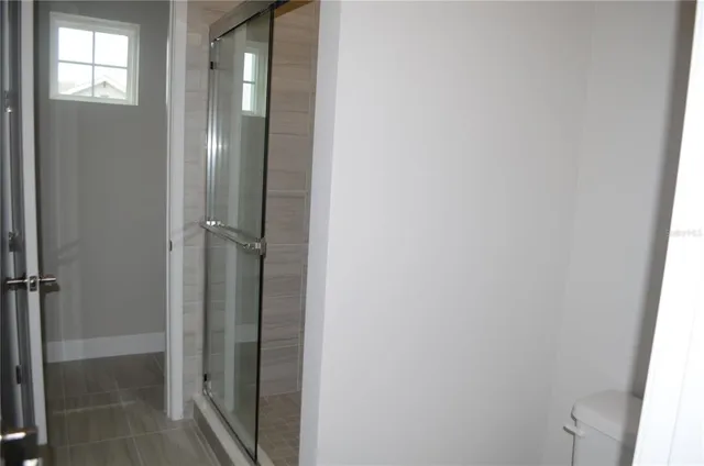 a bathroom with a bathtub and shower