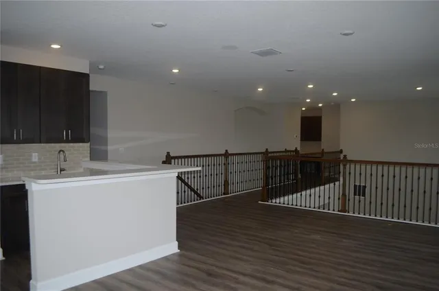 a view of a back yard from a balcony