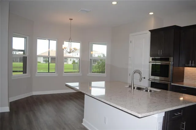 a kitchen with a sink and refrigerator