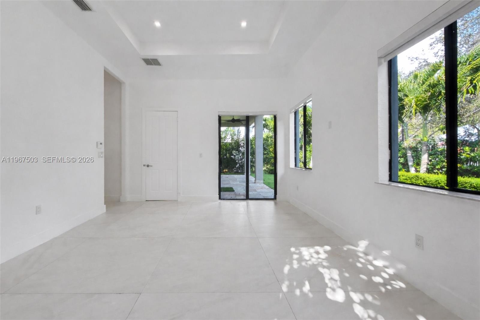 7733 Southwest 193rd Street Cutler Bay, FL 33157 - Photo 16 of 36 a view of an empty room with a window
