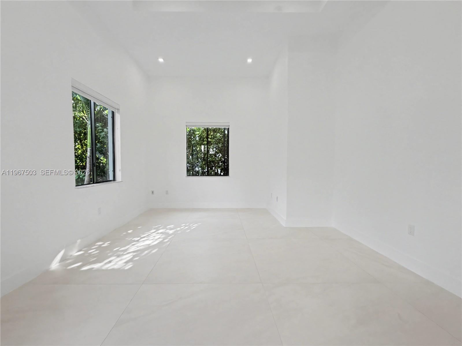 7733 Southwest 193rd Street Cutler Bay, FL 33157 - Photo 17 of 36 a view of an empty room with a window