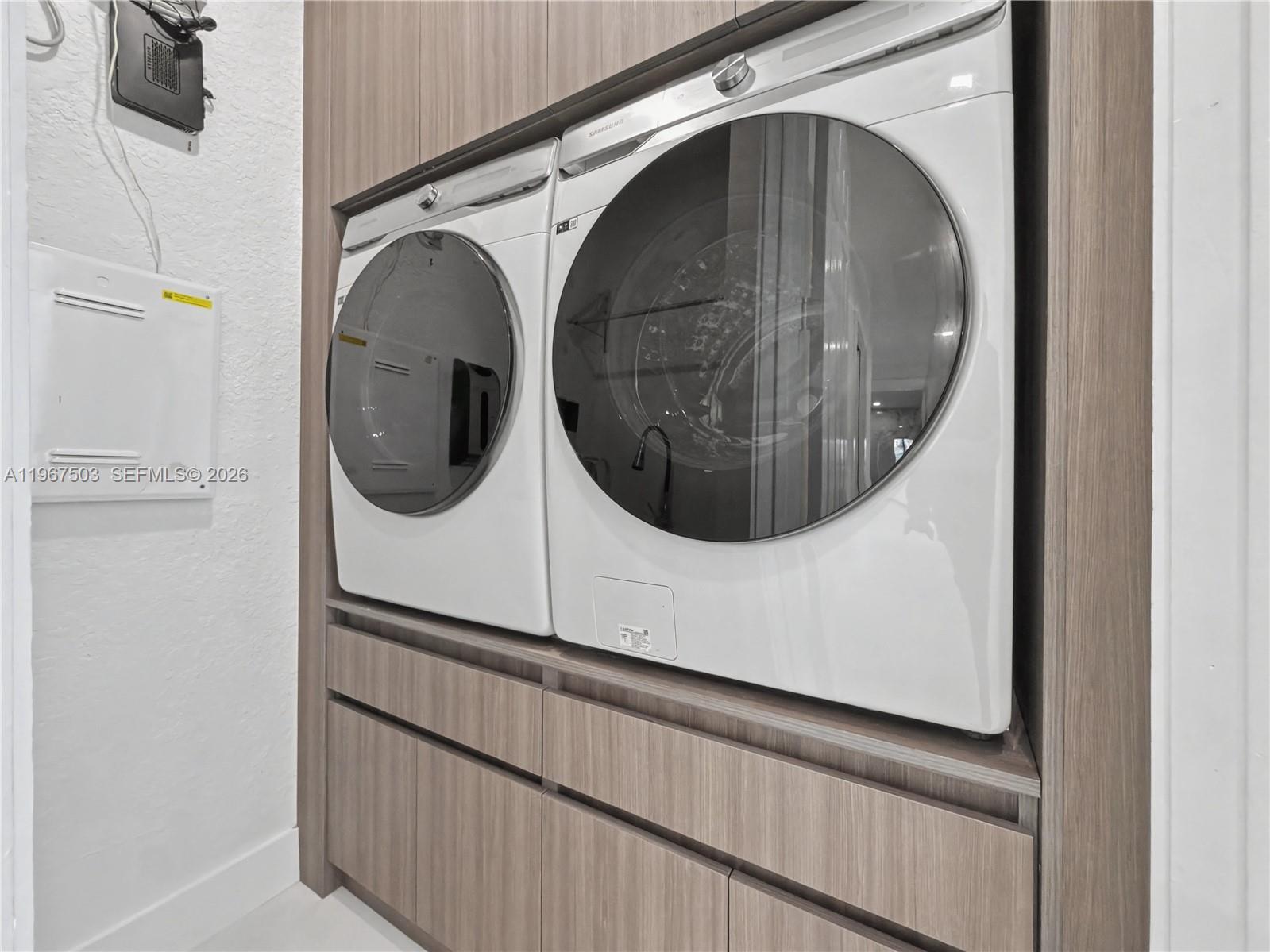 7733 Southwest 193rd Street Cutler Bay, FL 33157 - Photo 27 of 36 a utility room with dryer and washer