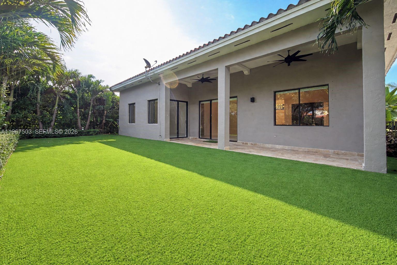 7733 Southwest 193rd Street Cutler Bay, FL 33157 - Photo 29 of 36 a view of a house with a yard