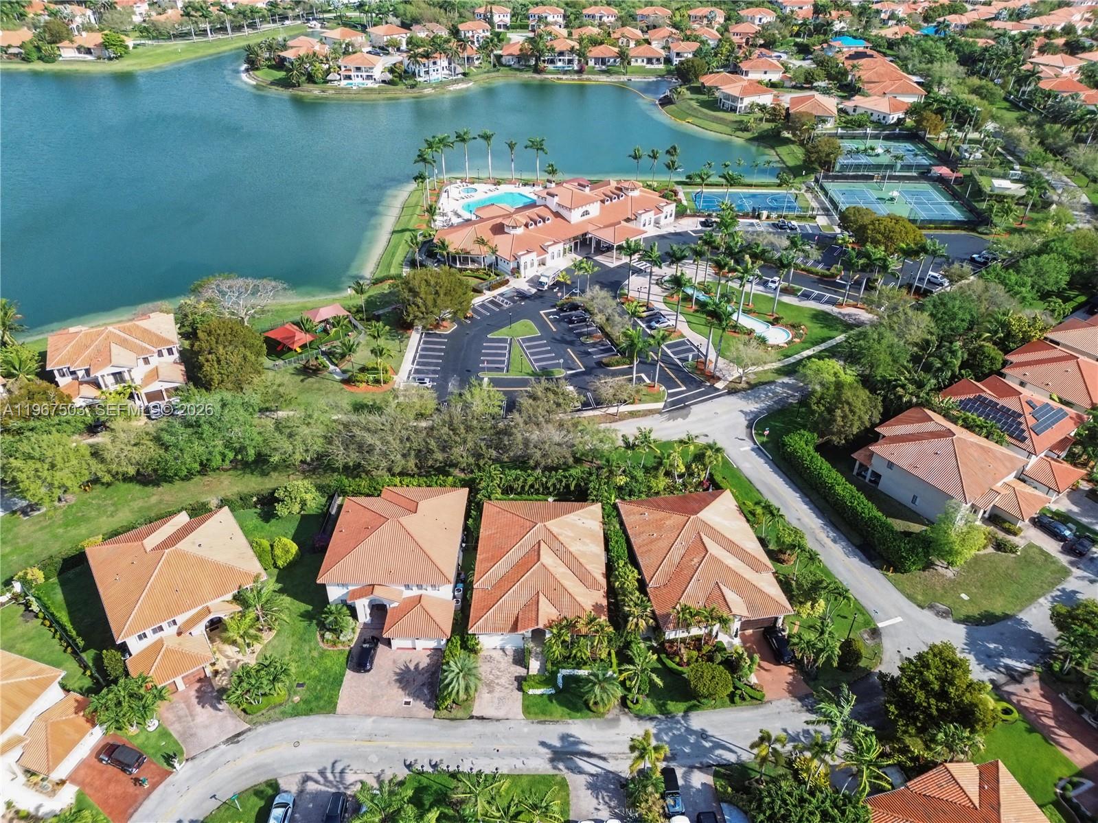 7733 Southwest 193rd Street Cutler Bay, FL 33157 - Photo 32 of 36 an aerial view of lake and residential houses with outdoor space