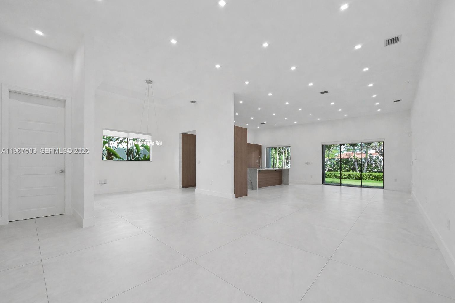 7733 Southwest 193rd Street Cutler Bay, FL 33157 - Photo 4 of 36 a view of an empty room with a window