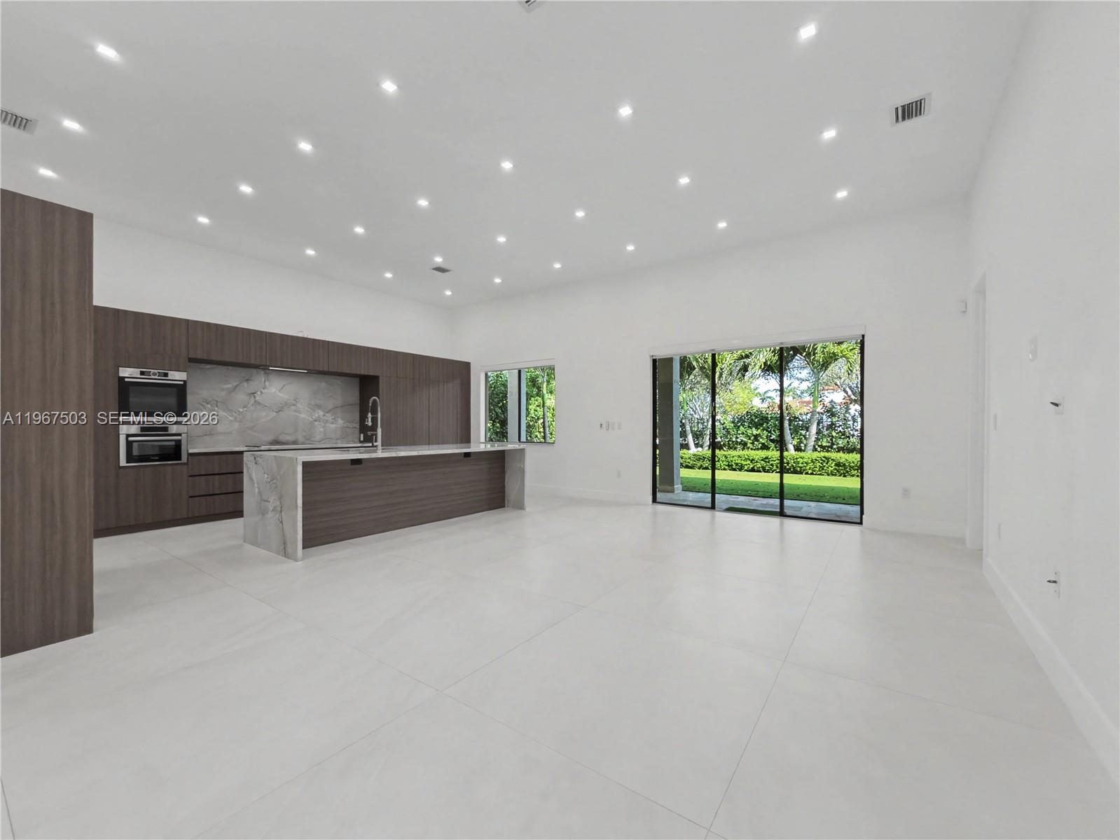7733 Southwest 193rd Street Cutler Bay, FL 33157 - Photo 5 of 36 a view of kitchen with stainless steel appliances refrigerator oven and cabinets
