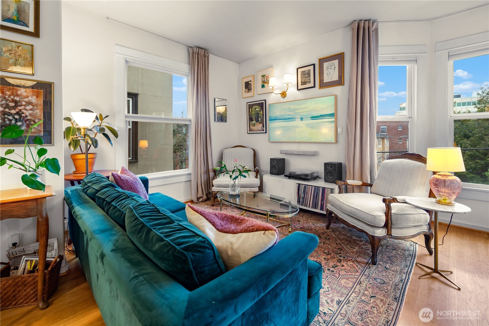 1732 15th Avenue, Unit 27 Seattle, WA 98122 - Photo 13 of 27 a living room with furniture and a flat screen tv