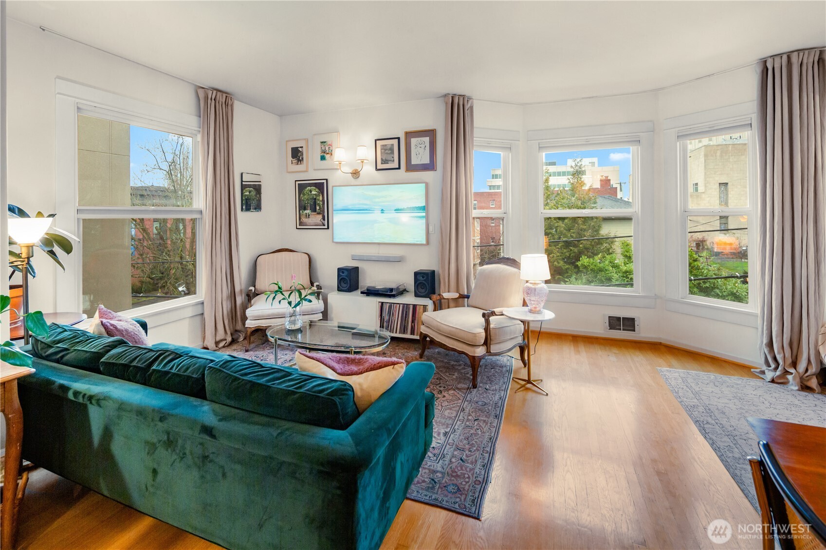 1732 15th Avenue, Unit 27 Seattle, WA 98122 - Photo 16 of 27 a living room with furniture and a large window