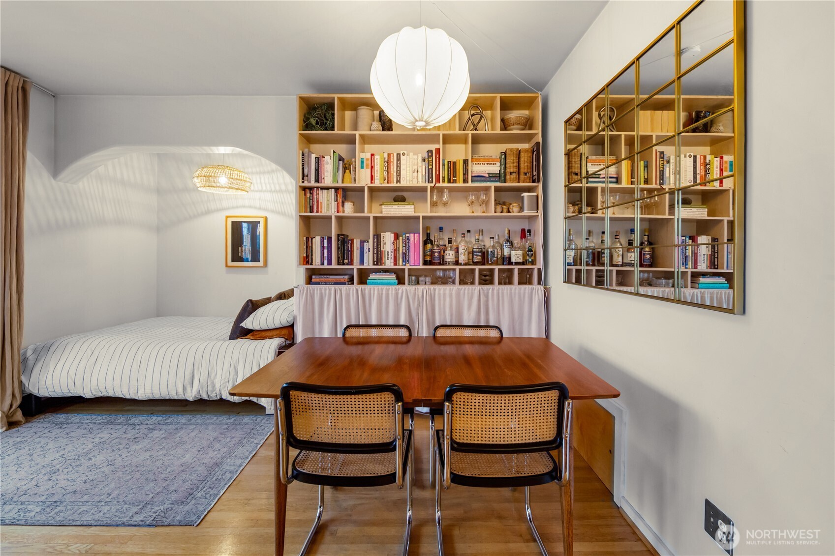 1732 15th Avenue, Unit 27 Seattle, WA 98122 - Photo 17 of 27 a dining room with furniture and wooden floor