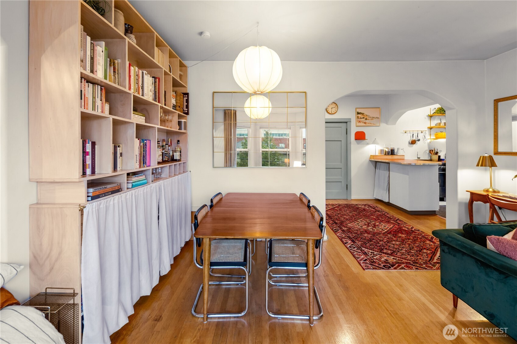 1732 15th Avenue, Unit 27 Seattle, WA 98122 - Photo 18 of 27 a bedroom with furniture and a chandelier