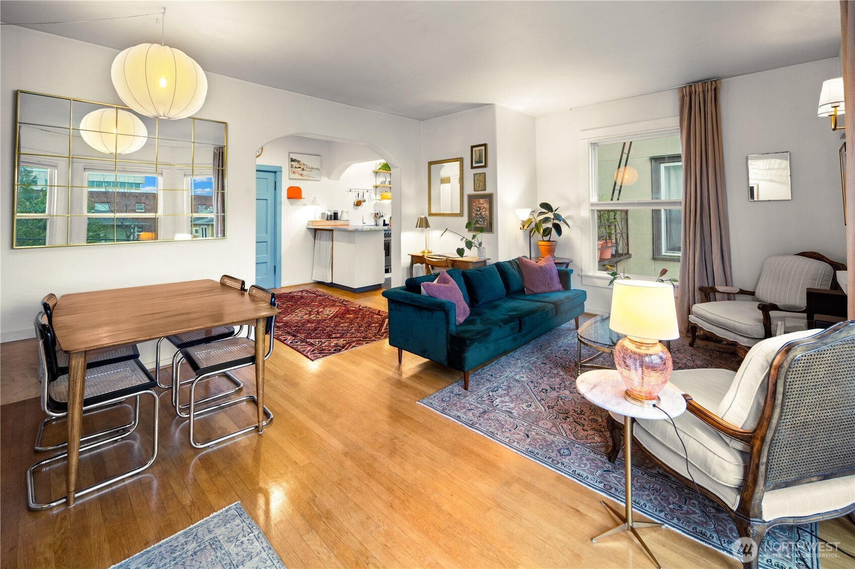 1732 15th Avenue, Unit 27 Seattle, WA 98122 - Photo 19 of 27 a living room with furniture a table and large window