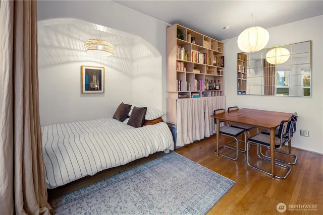 a bedroom with a bed and a table in it