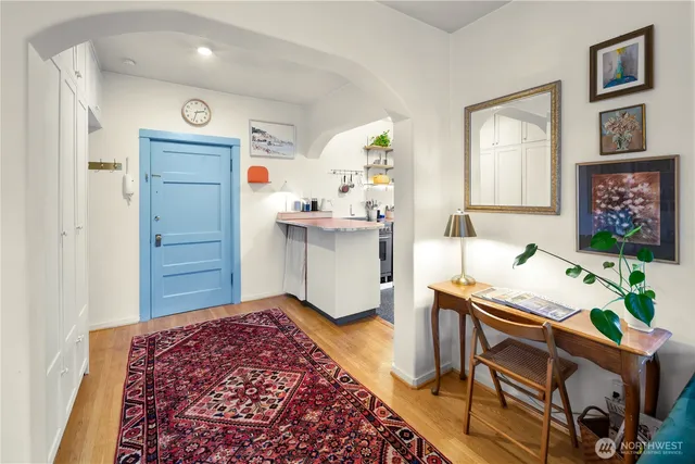 a workspace room with furniture and a window