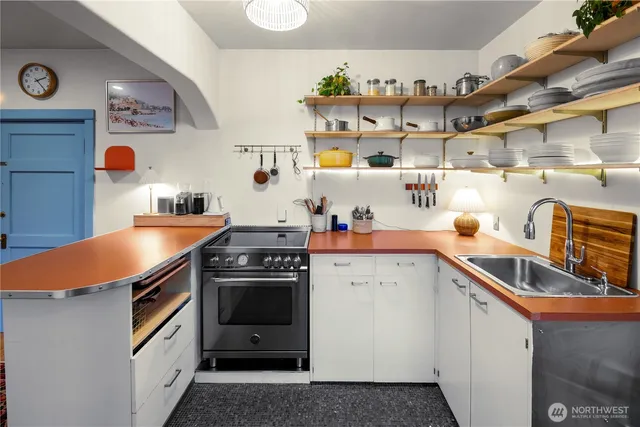 a kitchen with a stove and a sink