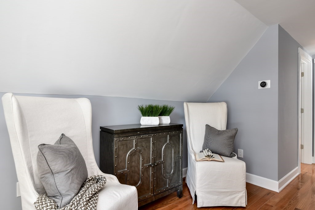 18 Damon Street, Unit 18 Wayland, MA 01778 - Photo 16 of 24 a living room with furniture and a potted plant
