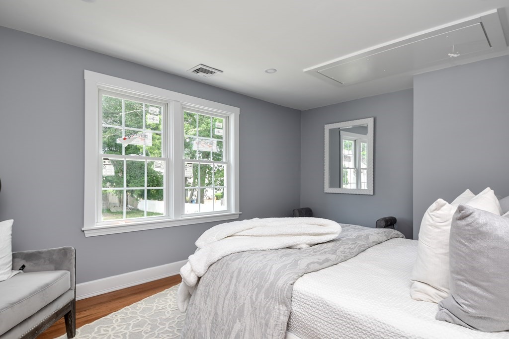 18 Damon Street, Unit 18 Wayland, MA 01778 - Photo 17 of 24 a bedroom with a bed and a window