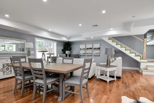 a view of a dining room with furniture window and wooden floor