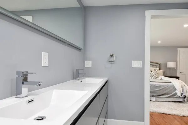 a en suite bathroom with a sink and a tub