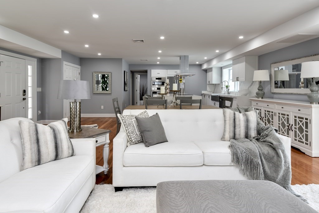 18 Damon Street, Unit 18 Wayland, MA 01778 - Photo 5 of 24 a living room with furniture kitchen view and a couch