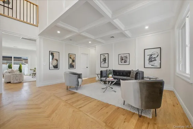 a living room with furniture and painting on the wall