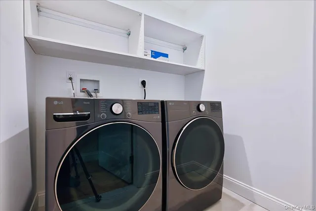 a bathroom with a sink a mirror a toilet and shower