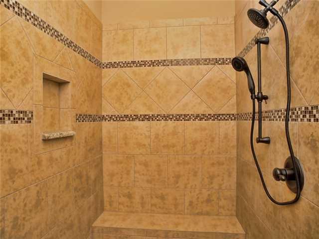 104 Vista Lane Georgetown, TX 78633 - Photo 15 of 36 A spectacular walk in shower with embellished tile work.