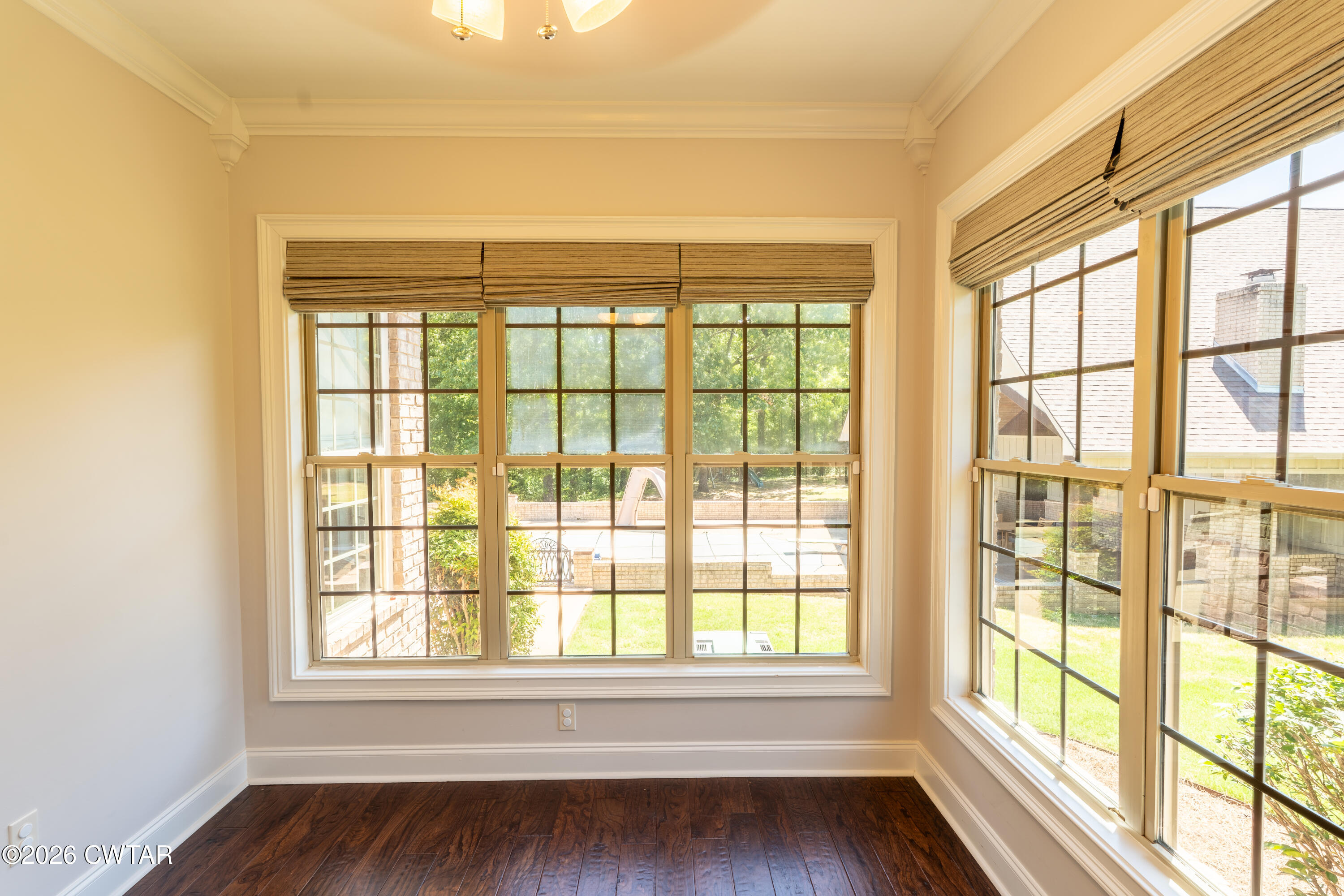 227 Willie Johnson Road Dyersburg, TN 38024 - Photo 15 of 43 a view of an empty room with wooden floor and a window