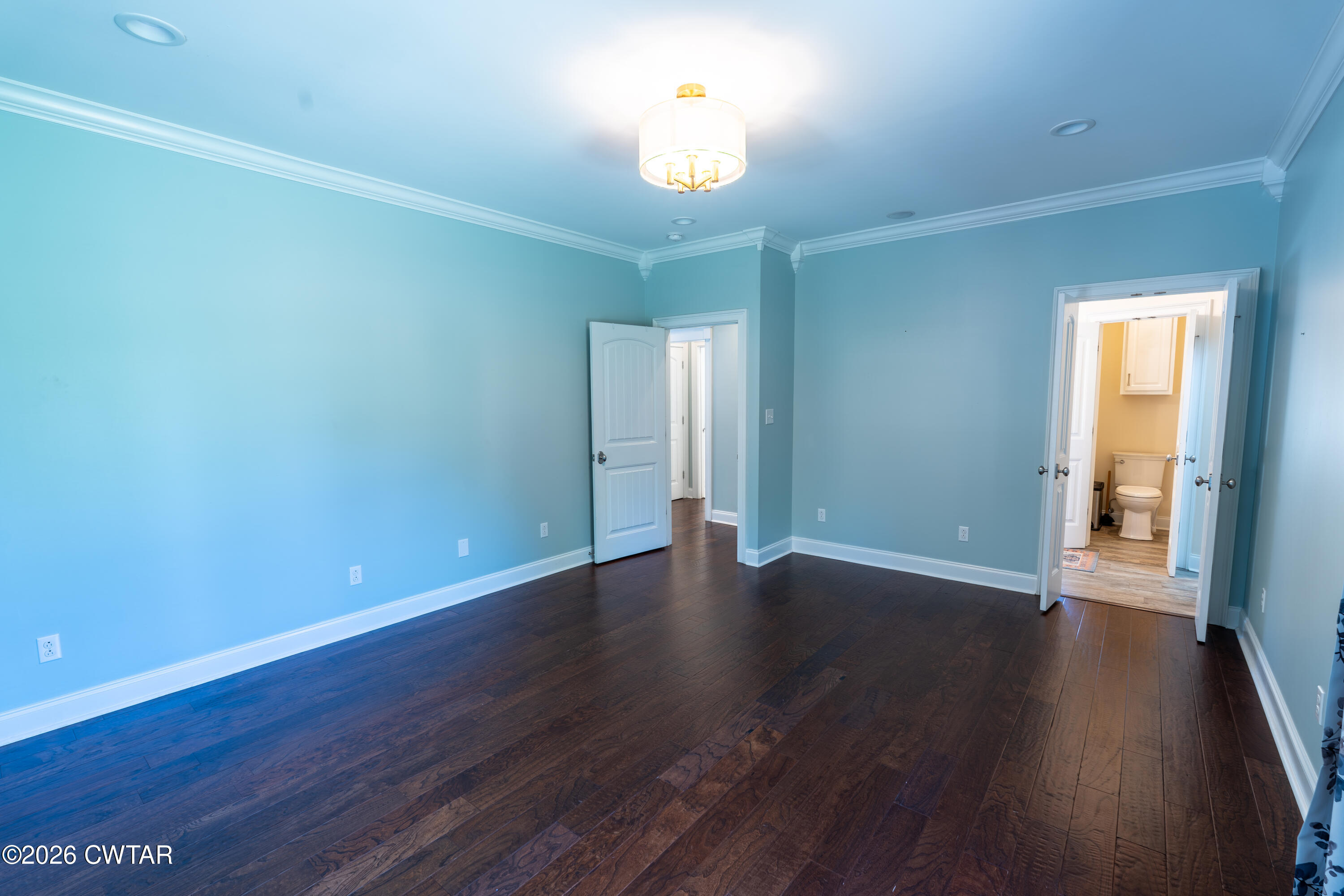 227 Willie Johnson Road Dyersburg, TN 38024 - Photo 17 of 43 an empty room with wooden floor and windows