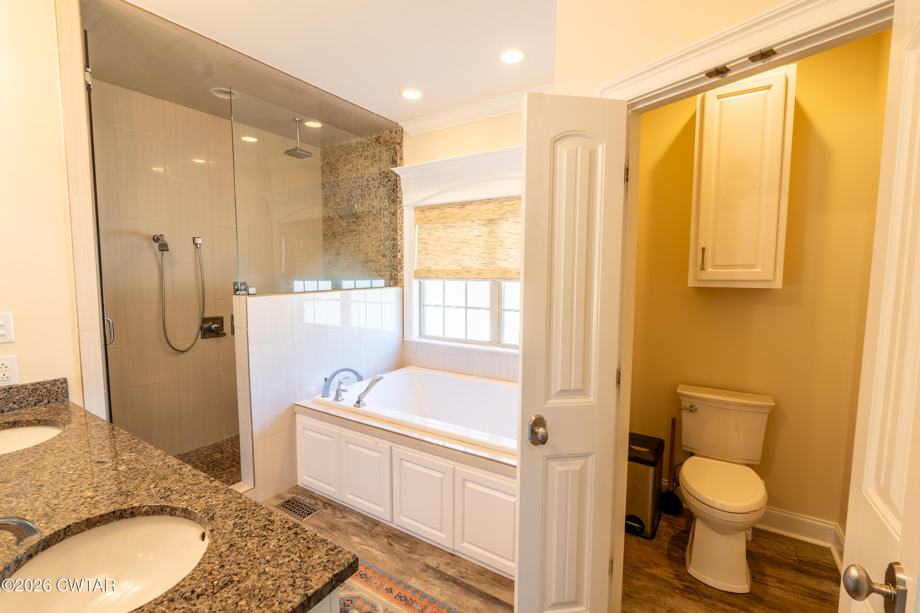 227 Willie Johnson Road Dyersburg, TN 38024 - Photo 18 of 43 a bathroom with a granite countertop sink toilet and shower