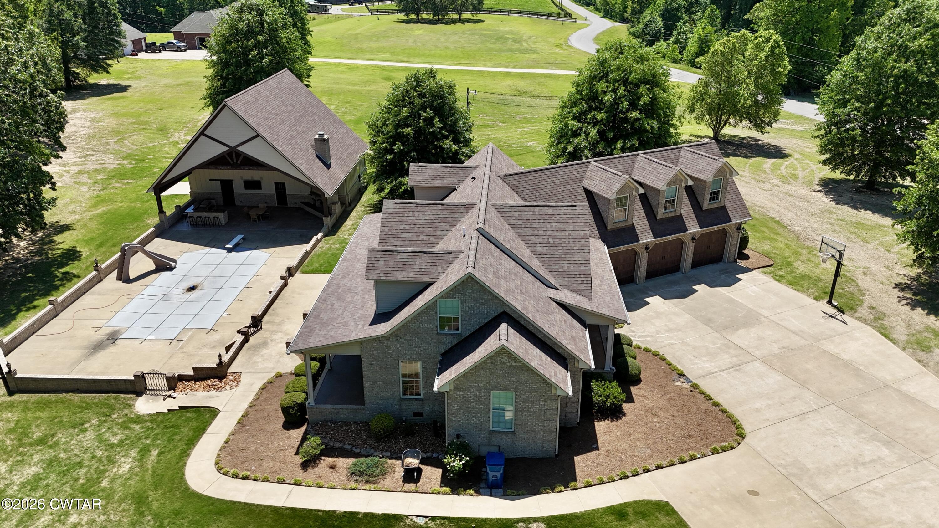 227 Willie Johnson Road Dyersburg, TN 38024 - Photo 2 of 43 an aerial view of a house with a yard table and chairs
