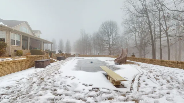 a view of swimming pool with outdoor seating