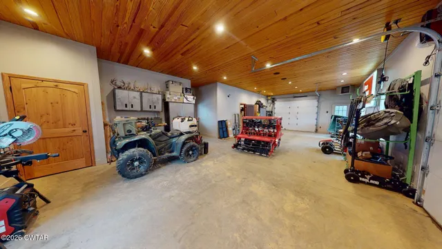 a view of a garage with a bike and a car