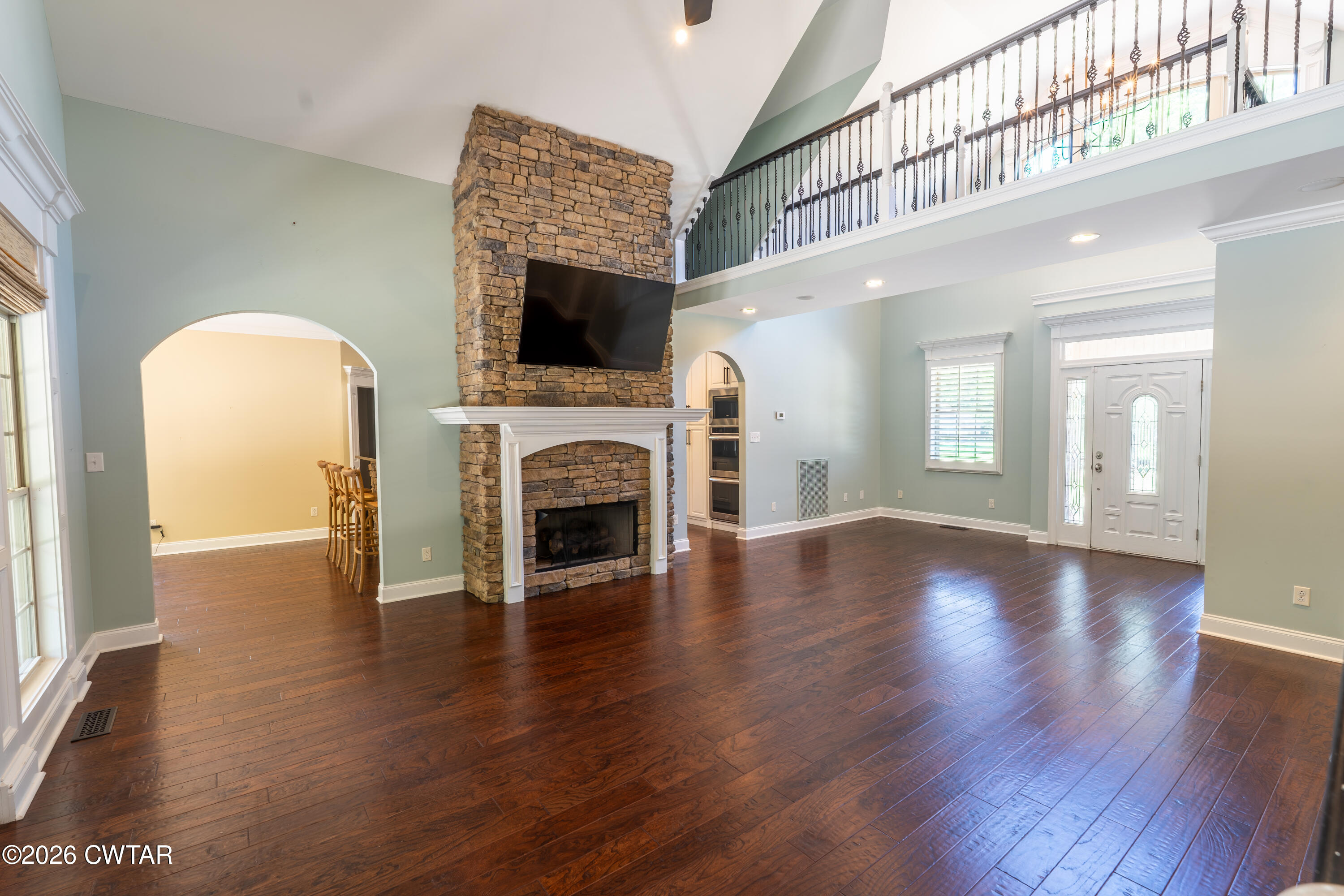 227 Willie Johnson Road Dyersburg, TN 38024 - Photo 8 of 43 a view of empty room with fireplace and wooden floor